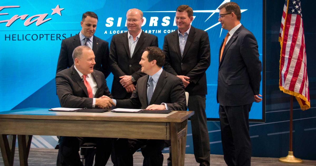 Sikorsky CEO Dan Schultz (left) and Era Group president and CEO Chris Bradshaw shake hands after signing their companies’ agreement for the 300th S-92 helicopter. The milestone airframe, which is already produced, will enter service in the Gulf of Mexico later this month. Era is one of the largest helicopter operators in the world and claims it is the longest-serving helicopter transport provider in the U.S.