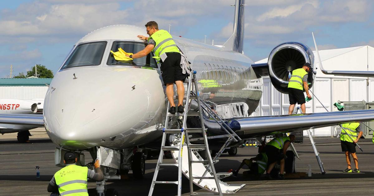 An Embraer Legacy 650 gets the once-over from a cleaning crew after its arrival at Orlando’s Executive Airport for NBAA-BACE 2018.