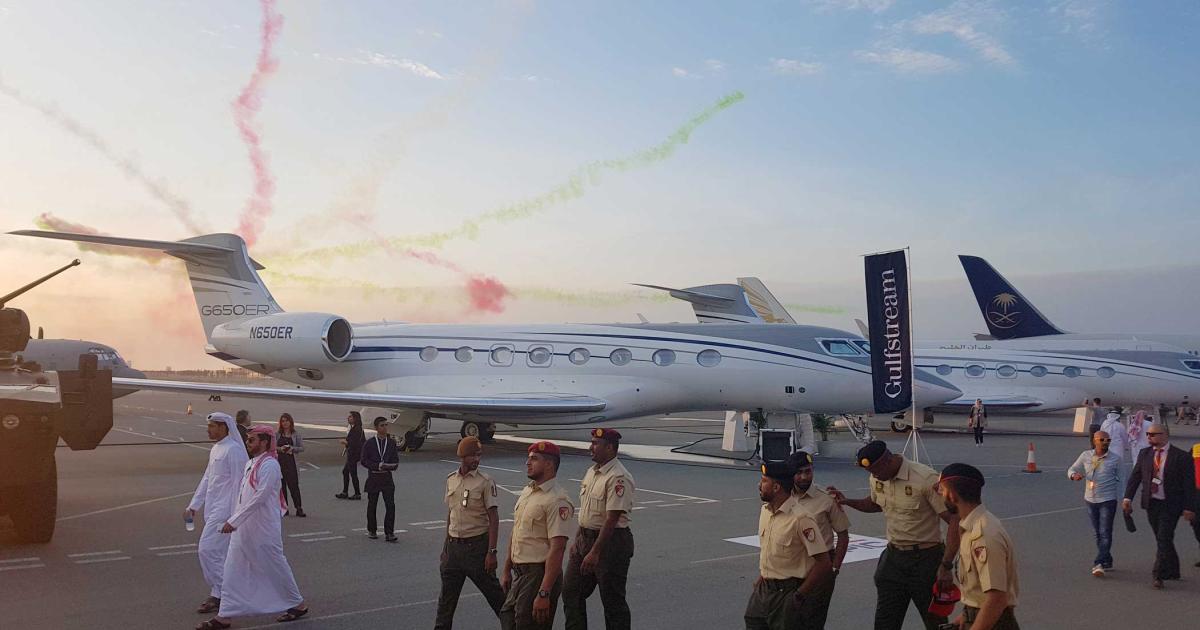 Attendees at the 2018 Bahrain International Airshow stroll past the Gulfstream Aerospace exhibit. The three-day event included a mix of aircraft on static display and performances by national flight demonstration teams.
