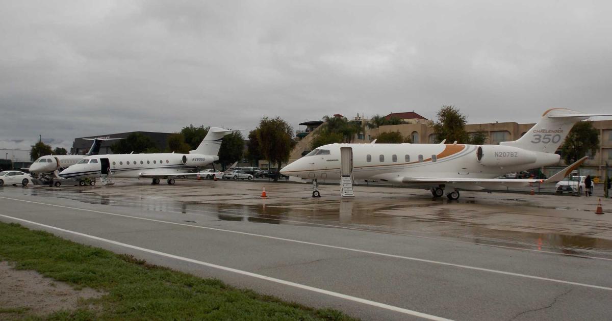 One of the highlights of Business Jets Fuel Green: A Step Towards Sustainability, held yesterday at a rainy Van Nuys Airport was demonstration flights provided by (left to right) Embraer Executive Aircraft (Legacy 500), Gulfstream (G280) and Bombardier Business Aircraft (Challenger 350). (Photo: Curt Epstein)