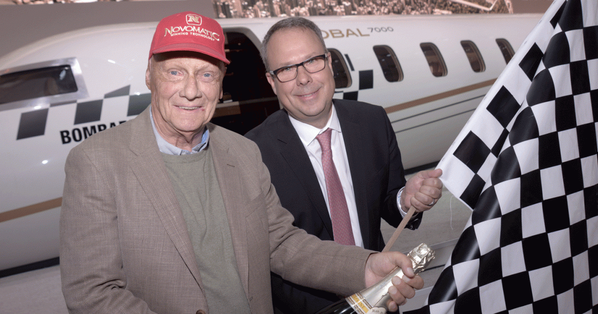 Niki Lauda, left, celebrated with Peter Likoray, senior v-p Bombardier Business Aircraft, after placing his order for his then-Global 7000 at EBACE 2015.