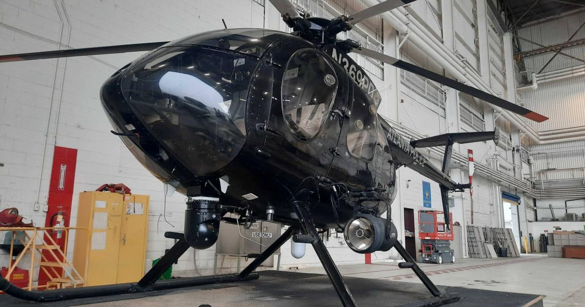 MD 500E Helicopter operated by the Atlanta Police Department in hangar on tow cart
