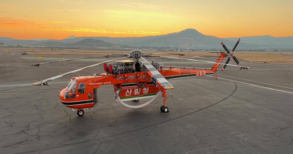 Overhead view of Erickson S-64 Air Crane on airport ramp at sunset