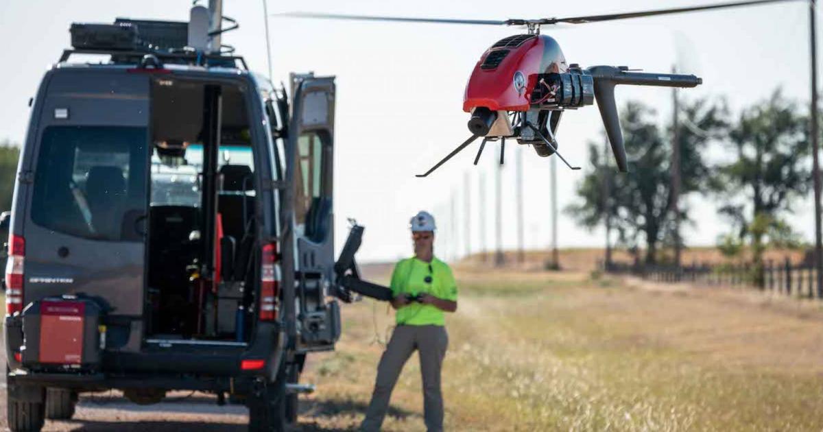 Phoenix Air Unmanned drone operator flies drone near company van