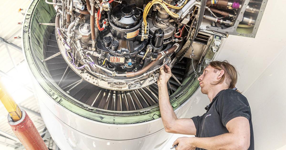 FAI Technik aircraft maintenance technician at work on jet engine