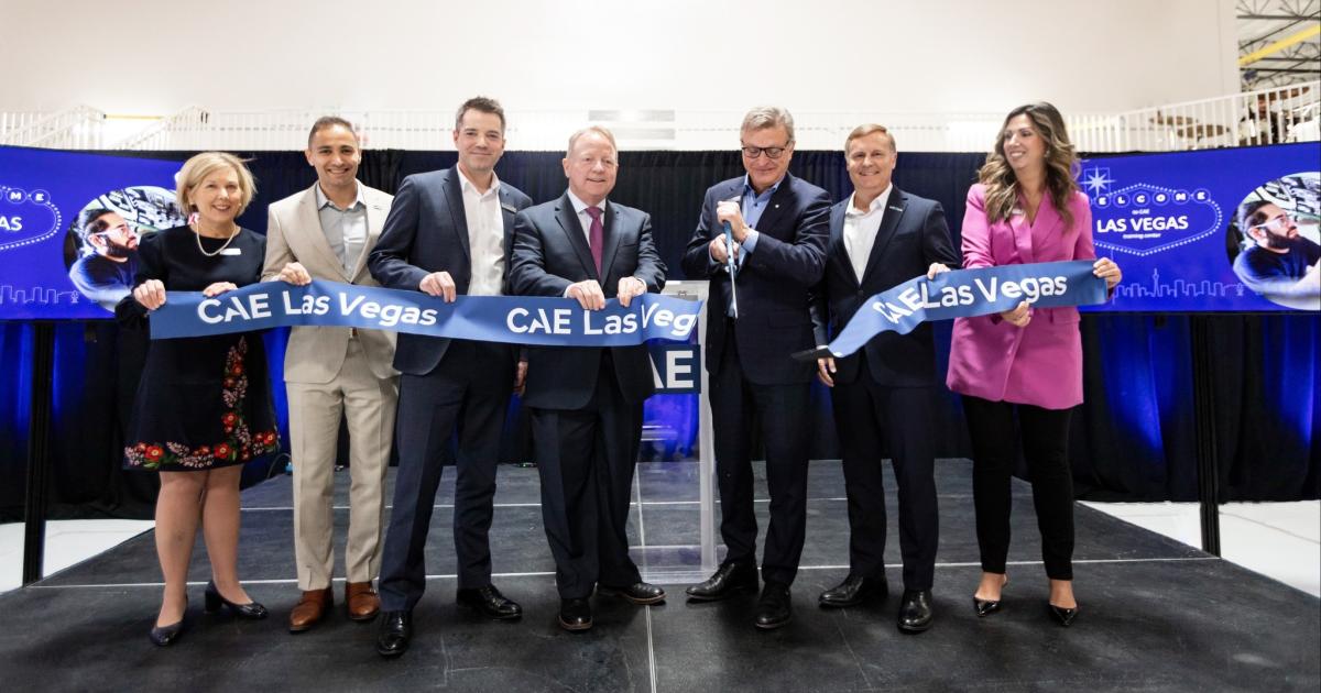 CAE president and CEO Marc Parent (center) cuts ribbon alongside colleagues during Las Vegas Training center inauguration 