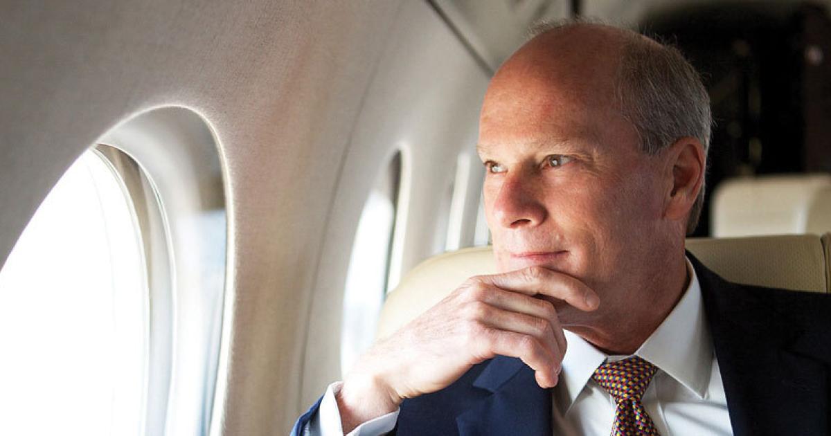 Larry Flynn looking out window in Gulfstream business jet